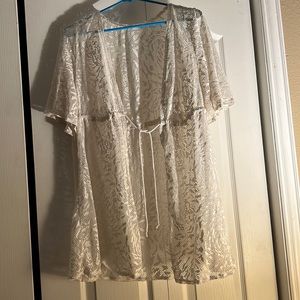 All white crochet swimsuit cover up.